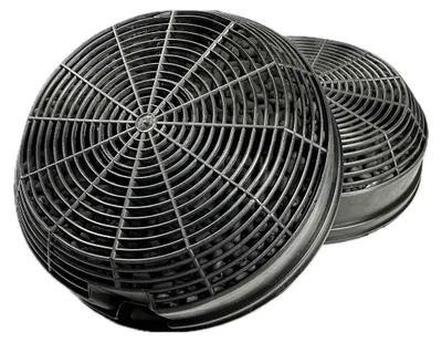 Two round charcoal filters for a range hood.