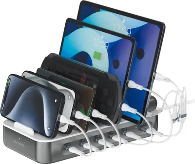 A charging station with multiple devices plugged in.