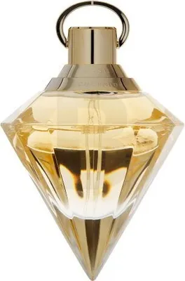 A diamond-shaped perfume bottle with golden liquid inside, against a white background.