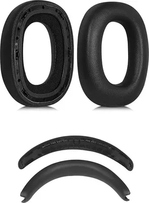 A set of black replacement ear pads and a headband cushion for headphones.