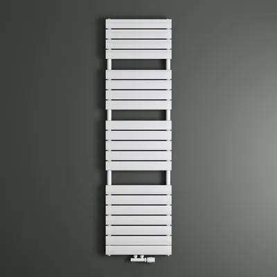 A white radiator is mounted on a dark gray wall.