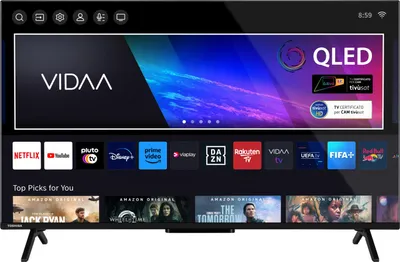 A Toshiba QLED Smart TV displaying its user interface with various app icons and movie posters.