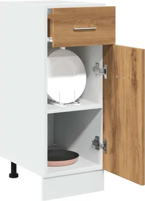 A white kitchen cabinet with a wooden drawer and door, showing shelves with plates and a pan.
