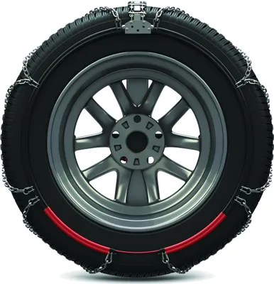 A close-up studio shot of a car tire with snow chains attached.
