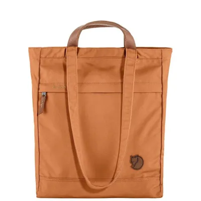 A brown tote bag with leather handles and a small zippered pocket on the front.