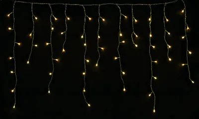 A string of warm white LED lights against a black background.