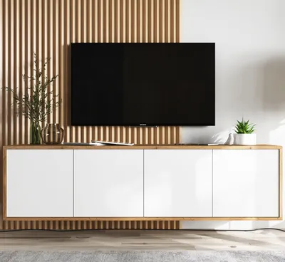 A modern TV stand with a large black television mounted above it, set against a slatted wooden wall.
