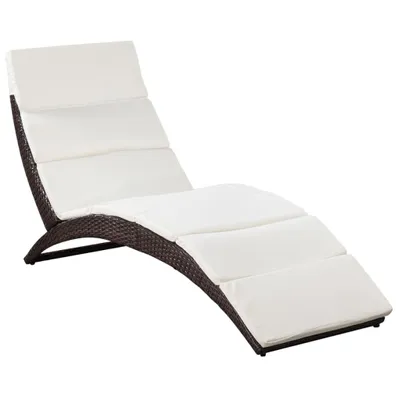 A brown rattan chaise lounge with white cushions, shown on a white background.