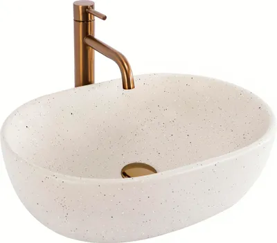A white speckled basin with a bronze faucet against a white background.
