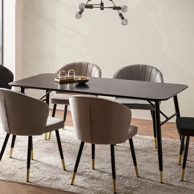 A dining table with chairs in a modern dining room setting.