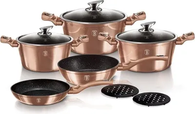 A set of rose gold cookware, including pots, pans, and lids, is arranged on a white background.