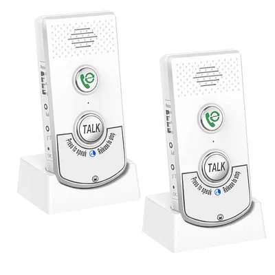 Two white wireless intercom devices are shown in their charging docks against a white background.