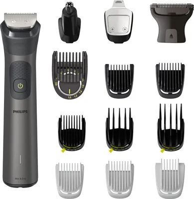 A collection of grooming tools and attachments, including a main trimmer unit, nose trimmer, and various comb attachments, laid out against a white background.