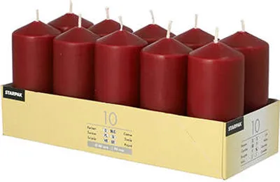 A pack of red pillar candles in a cardboard box.