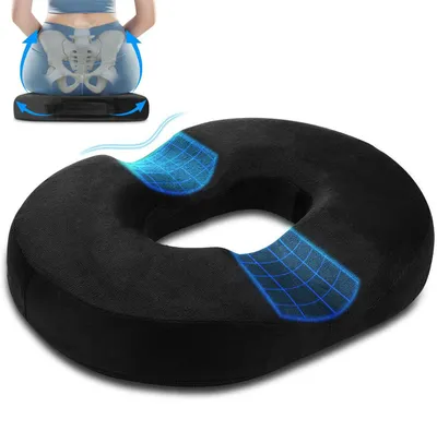 A black ring cushion is shown in the foreground, with a diagram of a person sitting on a similar cushion in the background, illustrating spinal alignment.