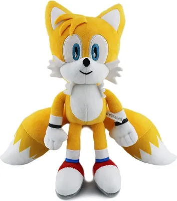 A plush toy of the character Tails from Sonic the Hedgehog, standing upright against a white background.