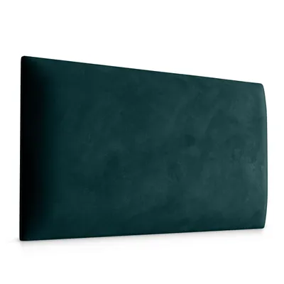 A teal upholstered headboard shown from a side angle.