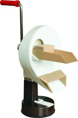 A close-up studio shot of a manual food slicer.