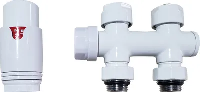 A white radiator valve set with a thermostat and a manifold is shown against a white background.
