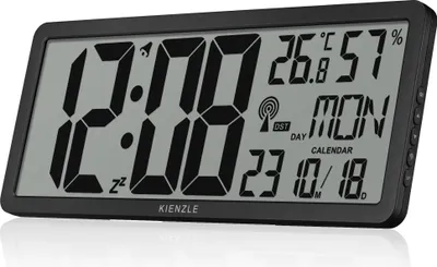 A digital clock displaying time, temperature, humidity, day, and date.