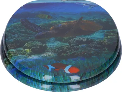 A toilet seat with an underwater scene featuring a sea turtle and clownfish.