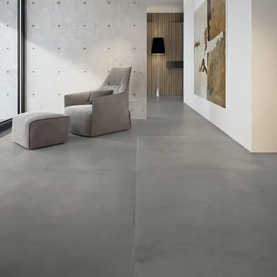 Imagen del producto de CASA39. Gres porcelánico con efecto cemento, color gris, dimensiones 120x120 cm, marca Marazzi, colección Grande, aspecto de hormigón