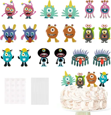 A collection of cartoon monster-themed party decorations, including cake toppers, and what appear to be balloon and garland elements, arranged on a white background. A cake with decorations is shown in the lower right corner.