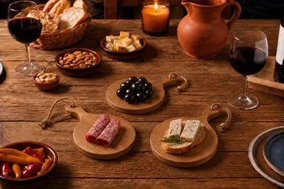 Produktbild von Stilvolle mini Holz Servierbretter mit Griff Tapas 4er Brettchen, rund