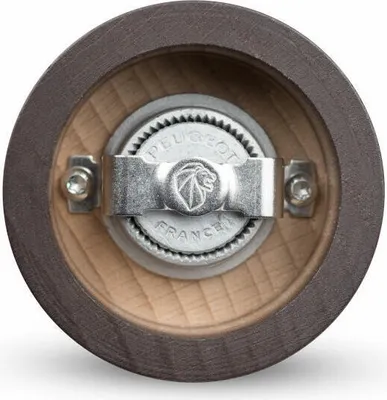 Close-up view of the grinding mechanism of a pepper mill.