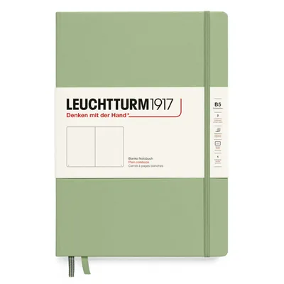A Leuchtturm1917 notebook with a plain cover and a paper band around it.