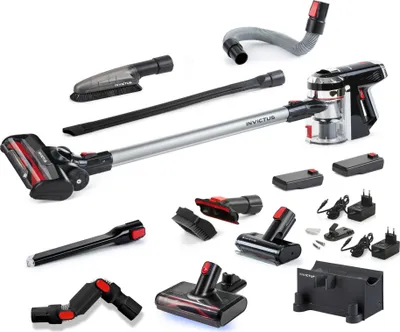 A collection of cordless vacuum cleaner parts and accessories, including the main unit, various brush heads, extension tubes, batteries, and chargers, arranged on a white background.