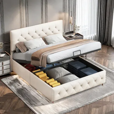 A bedroom scene featuring a storage bed with its storage compartment open, revealing neatly folded linens and pillows.