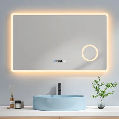 A modern bathroom vanity with a light blue sink and a large LED mirror above it.