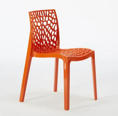 An orange plastic chair with a patterned seat and backrest is shown against a white background.