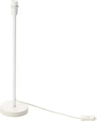 A white table lamp base with a cord and switch on a white background.