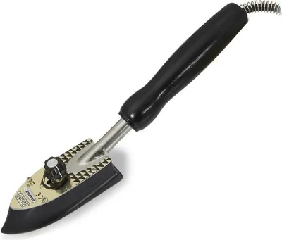 A close-up studio shot of a small electric iron.