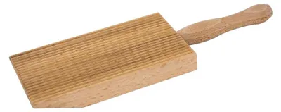 A wooden gnocchi board with a handle is shown against a white background.
