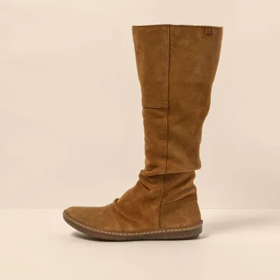 A side view of a brown suede boot against a plain background.