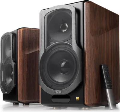 Two Edifier S2000MKIII speakers are shown, one in the foreground and one slightly behind and to the left. A remote control is placed on the right side of the foreground speaker.