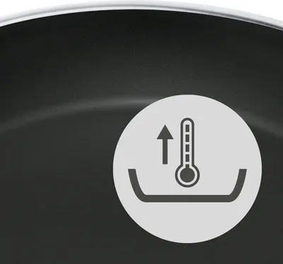 A close-up of a cooking pan with a circular icon indicating temperature increase.