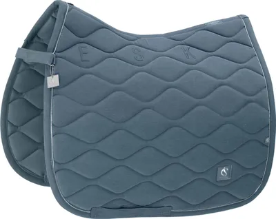 A close-up studio shot of a blue horse saddle pad.