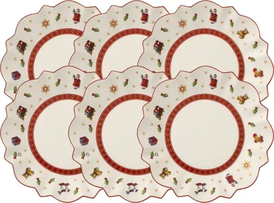 A set of six decorative plates with a scalloped edge, arranged in two rows.