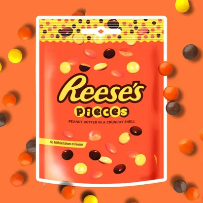 Productafbeelding van Reese's Pieces Pinda-boter zakje – 90g | Knapperige chocoladebolletjes met pindakaas