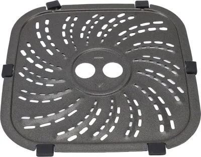 A top-down view of a gray metal grill plate with a swirling pattern of holes and two circular openings in the center. It has black rubber feet on each corner.