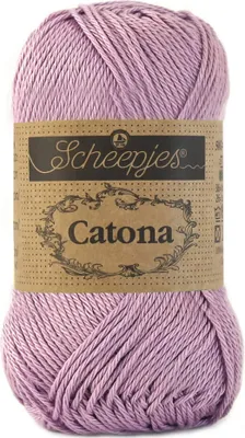 A ball of pink yarn with a brown label.