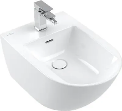 A white ceramic bidet with a chrome faucet.