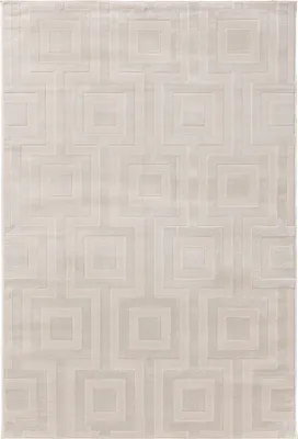 A flat lay of a cream-colored rug with a geometric pattern.