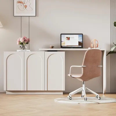 A modern home office setup with a white desk and a pink chair.