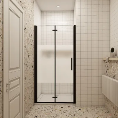 A modern bathroom with a black framed shower enclosure.