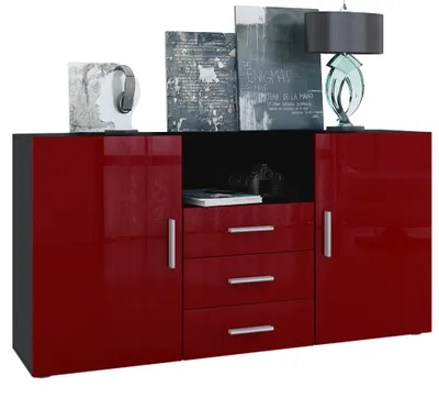 A sideboard with doors and drawers, decorated with books and a lamp.